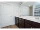 Bathroom with a dual sink vanity, a large mirror, and a shower-tub combo at 905 Alice Ct, Haw River, NC 27258
