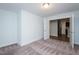Bedroom featuring carpet flooring and an open doorway to the living room at 905 Alice Ct, Haw River, NC 27258
