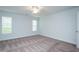 Bedroom with carpet flooring, two windows, and a ceiling fan at 905 Alice Ct, Haw River, NC 27258
