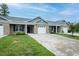Charming townhome exterior with a well-maintained lawn and a private driveway leading to a one-car garage at 905 Alice Ct, Haw River, NC 27258