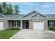 Charming brick home features a one-car garage, inviting curb appeal, and well-maintained landscaping at 905 Alice Ct, Haw River, NC 27258