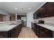 Modern kitchen boasts stainless steel appliances, dark cabinetry, and a functional layout at 905 Alice Ct, Haw River, NC 27258