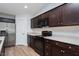 The kitchen features dark wood cabinets, stainless steel appliances, and ample counter space at 905 Alice Ct, Haw River, NC 27258