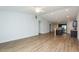 Bright living room with hardwood floors open to a modern kitchen and dining area at 905 Alice Ct, Haw River, NC 27258