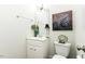 Well-lit half bathroom features a modern vanity, stylish mirror, and decorative accents at 9123 Thomas Rd, Rocky Mount, NC 27803