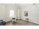 This bedroom features a rocking chair, and light gray carpet at 9123 Thomas Rd, Rocky Mount, NC 27803