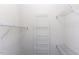 This walk-in closet features multiple white wire shelves for optimal storage and organization at 9123 Thomas Rd, Rocky Mount, NC 27803