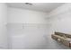 This walk-in closet features multiple white wire shelves and a small door at 9123 Thomas Rd, Rocky Mount, NC 27803