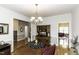 Spacious dining area featuring hardwood floors, crown molding, and chandelier lighting at 9123 Thomas Rd, Rocky Mount, NC 27803