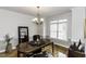 Stylish dining room features a wooden table, large window, and modern decor at 9123 Thomas Rd, Rocky Mount, NC 27803