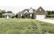 Beautiful brick home with an attached garage and a well-manicured lawn at 9123 Thomas Rd, Rocky Mount, NC 27803
