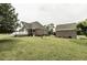 Brick house with lawn and patio, along with detached garage at 9123 Thomas Rd, Rocky Mount, NC 27803