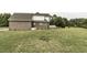 Side view of brick house with green grass at 9123 Thomas Rd, Rocky Mount, NC 27803