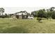 Brick house with large lawn and mature trees at 9123 Thomas Rd, Rocky Mount, NC 27803