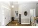 Welcoming foyer with wood floors, soft lighting, and views into other rooms at 9123 Thomas Rd, Rocky Mount, NC 27803