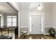 Inviting entryway with hardwood floors, decorative lighting, and transom window at 9123 Thomas Rd, Rocky Mount, NC 27803
