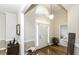 Bright and airy foyer featuring hardwood floors, white trim, and neutral paint colors at 9123 Thomas Rd, Rocky Mount, NC 27803