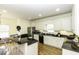 Eat-in kitchen boasting modern appliances, granite countertops, and barstool seating at 9123 Thomas Rd, Rocky Mount, NC 27803
