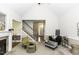 Bright living room with fireplace, stairs, open to entryway and contemporary furnishings at 9123 Thomas Rd, Rocky Mount, NC 27803