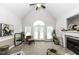 Bright living room features vaulted ceilings, a cozy fireplace, and access to outdoor space at 9123 Thomas Rd, Rocky Mount, NC 27803