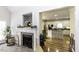 Bright living room with fireplace view to the kitchen boasting stainless steel appliances at 9123 Thomas Rd, Rocky Mount, NC 27803