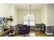Cozy sitting area with natural light, purple accents, and wood flooring at 9123 Thomas Rd, Rocky Mount, NC 27803