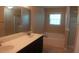 Well-lit bathroom with dual sinks, bathtub, and separate shower at 919 Middle Ground Ave, Rolesville, NC 27571
