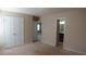 Bedroom with neutral carpet, closet, and view to bathroom at 919 Middle Ground Ave, Rolesville, NC 27571