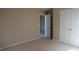 Neutral bedroom with beige carpet, closet, and doorway to other rooms in the house at 919 Middle Ground Ave, Rolesville, NC 27571