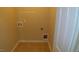 Functional laundry area with tile flooring and utility connections at 919 Middle Ground Ave, Rolesville, NC 27571
