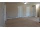 Spacious living room with multiple closets, featuring neutral carpet and ample natural light at 919 Middle Ground Ave, Rolesville, NC 27571
