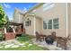 Backyard with wooden lounge furniture, fire pit and trees at 9639 Clubvalley Way, Raleigh, NC 27617