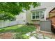 Cozy backyard featuring a well-maintained lawn, privacy fence, and a storage shed for outdoor convenience at 9639 Clubvalley Way, Raleigh, NC 27617