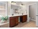 A double vanity is situated across from the garden tub and shower in the primary bathroom at 9639 Clubvalley Way, Raleigh, NC 27617