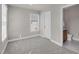 Bedroom boasts a window for natural light and an ensuite bathroom, offering convenience at 9639 Clubvalley Way, Raleigh, NC 27617