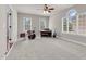 Spacious bedroom with three large windows and a ceiling fan, perfect for music at 9639 Clubvalley Way, Raleigh, NC 27617