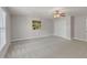 Bedroom with a ceiling fan, one window and gray carpet at 9639 Clubvalley Way, Raleigh, NC 27617