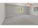 Bedroom with window, ceiling fan and carpet at 9639 Clubvalley Way, Raleigh, NC 27617