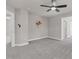 Bedroom features neutral walls, plush gray carpeting, and contemporary ceiling fan at 9639 Clubvalley Way, Raleigh, NC 27617