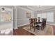 Traditional dining room with wood floors, an area rug, and a decorative chandelier at 9639 Clubvalley Way, Raleigh, NC 27617