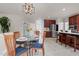 Open concept kitchen and dining area with stainless steel appliances and tile floors at 9639 Clubvalley Way, Raleigh, NC 27617