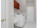 Efficient laundry room equipped with modern washer, dryer, and sink at 9639 Clubvalley Way, Raleigh, NC 27617