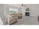 Inviting living room featuring a fireplace, neutral decor, and plush seating at 9639 Clubvalley Way, Raleigh, NC 27617