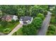 An aerial view shows the home's location in a verdant, tree-lined neighborhood with mature landscaping at 100 Citrus Pl, Cary, NC 27519