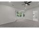 This bedroom boasts a large window nook, neutral walls, carpeted floors, and a ceiling fan at 100 Citrus Pl, Cary, NC 27519