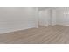 Elegant living room with wood floors, crown molding, chair railing, and recessed lighting at 100 Citrus Pl, Cary, NC 27519