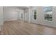 Inviting living room with beautiful wood floors, classic trim and moldings, and bright natural light at 100 Citrus Pl, Cary, NC 27519