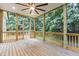 Spacious screened porch with ceiling fan and views of lush greenery at 100 Citrus Pl, Cary, NC 27519