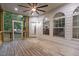 Charming screened porch with ceiling fan and wood flooring offers serene outdoor living at 100 Citrus Pl, Cary, NC 27519
