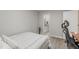 Bright bedroom offering an ensuite bathroom, wood flooring, and neutral walls at 101 Oyster Bay Ct # B2, Cary, NC 27513